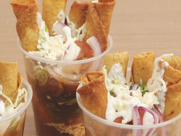 Tacos dorados en vaso